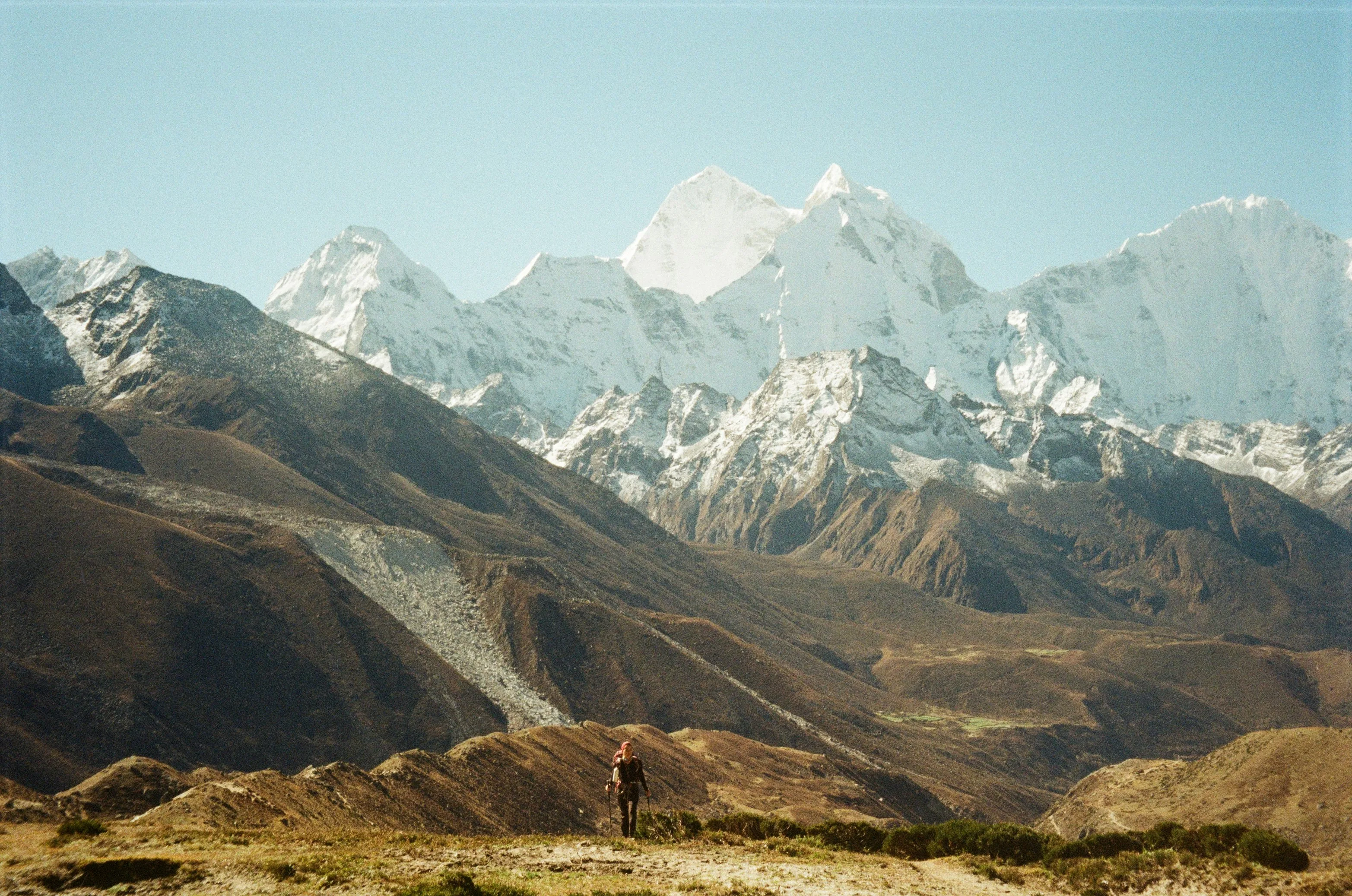Lone trekker beneath the Himalayan range